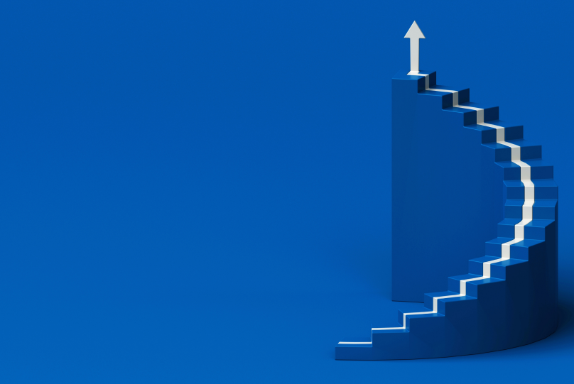 a white upward arrow on a blue staircase going up on a blue background identifying with top proptech companies in the us
